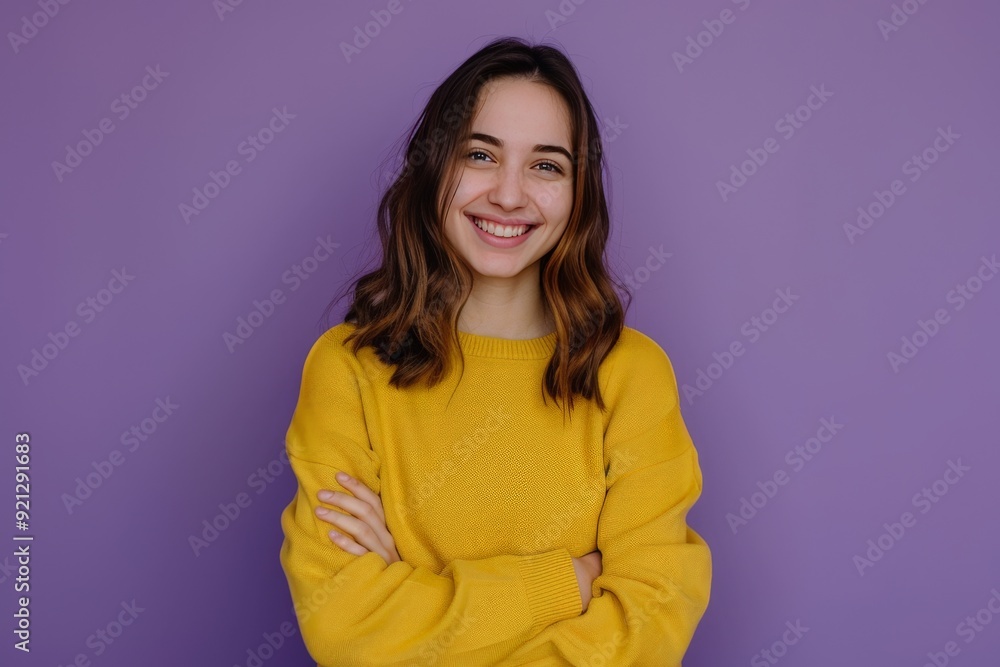 Attractive young representative of business people community standing confidently with arms crossed smiling toothily wearing yellow sweater isolated over purple pastel color background Attractive young representative of business people community standing confidently with arms crossed smiling toothily wearing yellow sweater isolated over purple pastel color background