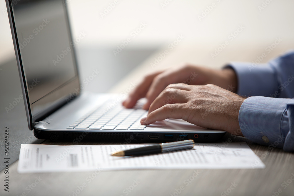 close up of a professional working on laptop close up of a professional working on laptop