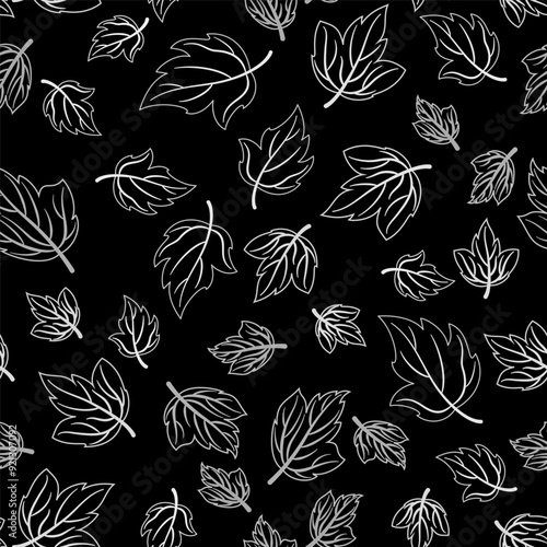 White leaves on black background. Monochrome vector seamless pattern with fall leaves. Randomly flying leaves. Dark late fall. Autumn background with white leaves for textile, wallpaper, etc.