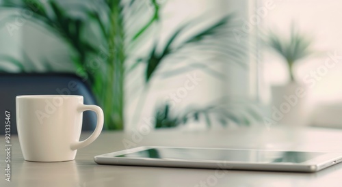 Cozy Workspace With Pink Mug and Tablet Surrounded by Green Plants