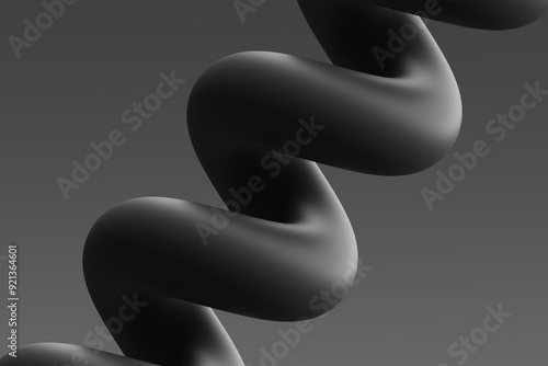 Abstract black twisted sculpture against a smooth gray background