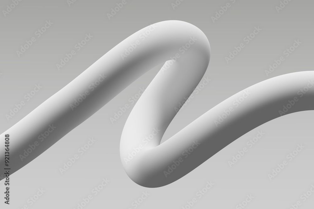 Curved white object on a gray background illustrating smooth lines and shapes