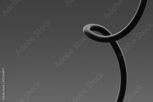 Black abstract sculpture twisting elegantly against a gray background