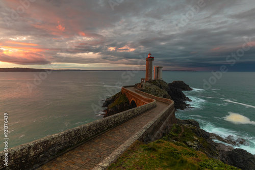 lighthouse at sunset photo