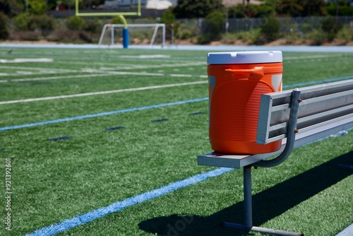 Photography energy drink container along the football field
