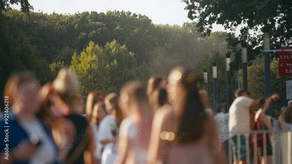 Bokeh blurred people crowd walking busy street slow motion shot, city life, lot of unrecognizable pedestrians, brightly lit crowded sidewalk, urban background, rush hour summer day. Warm sunlight Bokeh blurred people crowd walking busy street slow motion shot, city life, lot of unrecognizable pedestrians, brightly lit crowded sidewalk, urban background, rush hour summer day. Warm sunlight