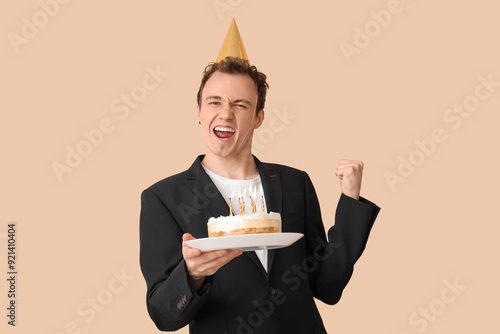Happy young businessman wit...