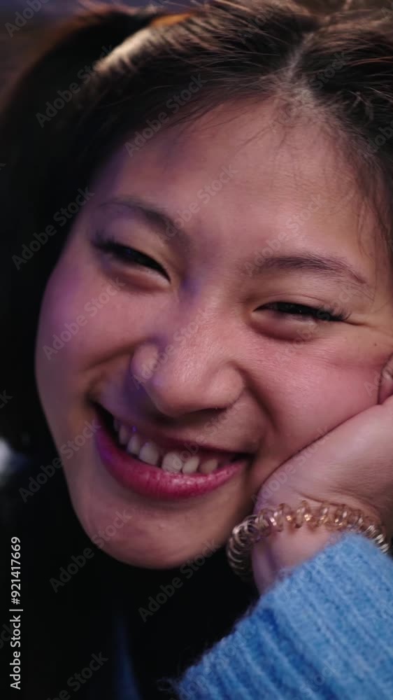 Vertical Close-up portrait of cheerful nice smile young Asian woman. Chinese flirtatious female looking laughing at camera. Beautiful positive girl leaning on hand. Happy gen z people home at night Vertical Close-up portrait of cheerful nice smile young Asian woman. Chinese flirtatious female looking laughing at camera. Beautiful positive girl leaning on hand. Happy gen z people home at night