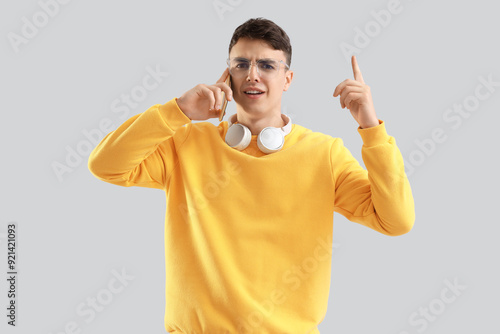 Angry young man talking by ...