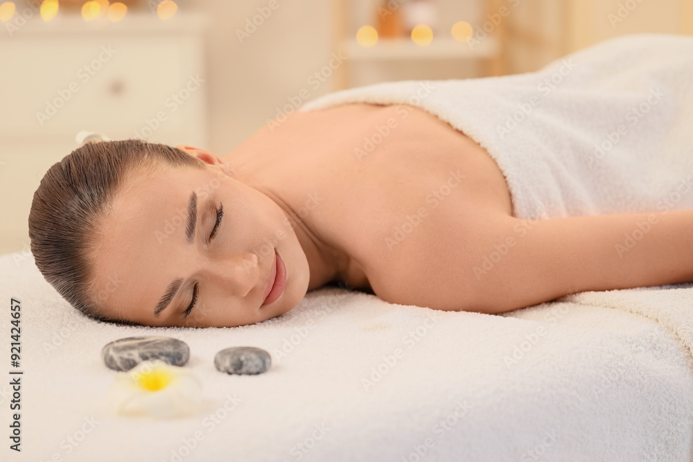 Young woman resting after massage in spa salon Young woman resting after massage in spa salon