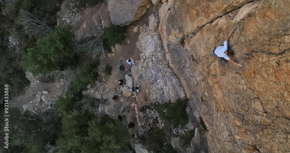 High shot over young rock climber on moutnain High shot over young rock climber on moutnain