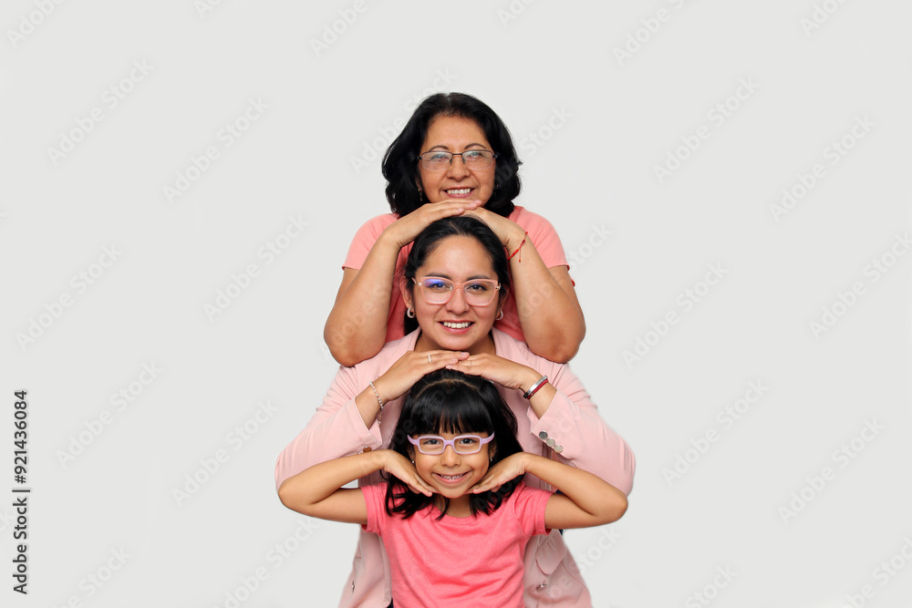 Grandmother, mom and daughter, three generations of dark-skinned Latina women show the importance of ancestors and female lineage on Mother's Day Grandmother, mom and daughter, three generations of dark-skinned Latina women show the importance of ancestors and female lineage on Mother's Day