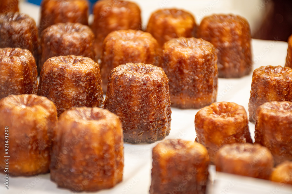 Canele, French pastry flavored with rum and vanilla, specialty of Bordeaux region, France Canele, French pastry flavored with rum and vanilla, specialty of Bordeaux region, France