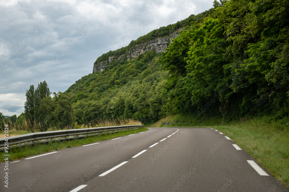 Fototapeta premium Driving car or camper on free road Route Napoleon in French Alps, touristic road in France