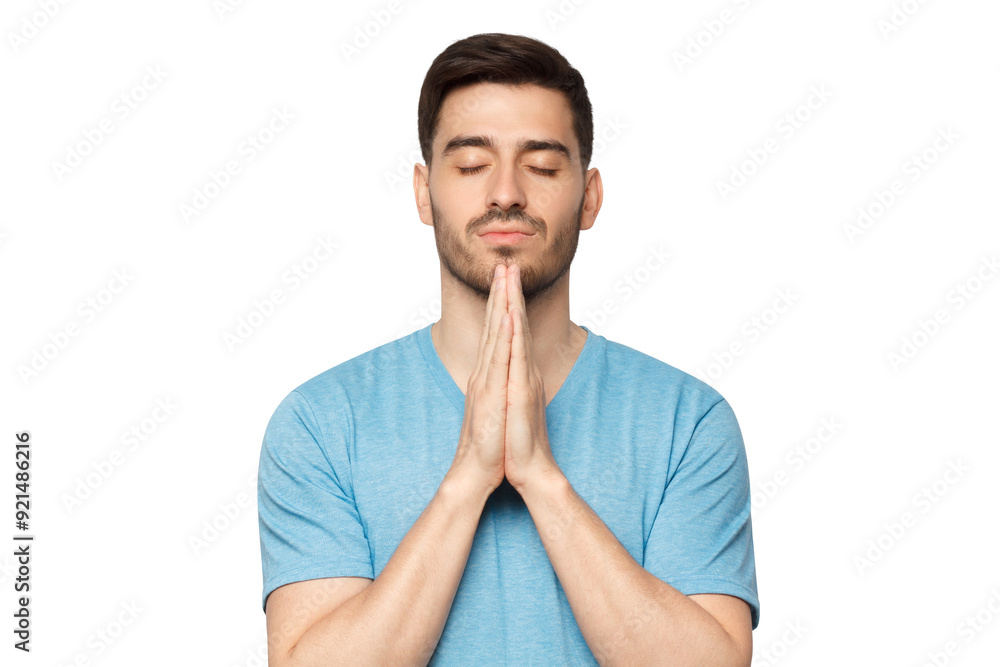 Close-up of young man putting hands together as if he is praying with closed eyes Close-up of young man putting hands together as if he is praying with closed eyes
