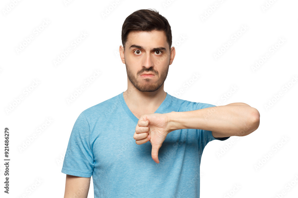 Young dissatisfied man showing thumb down or dislike Young dissatisfied man showing thumb down or dislike