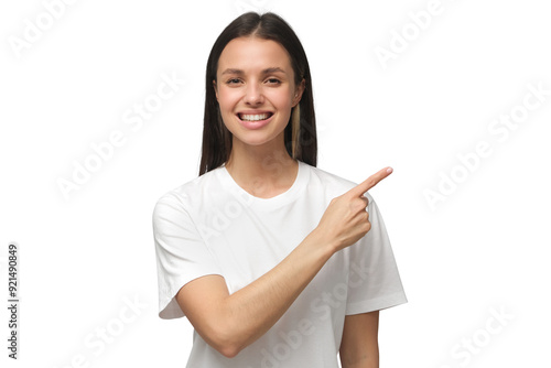 Smiling young woman in white t-shirt pointing right with index finger photo