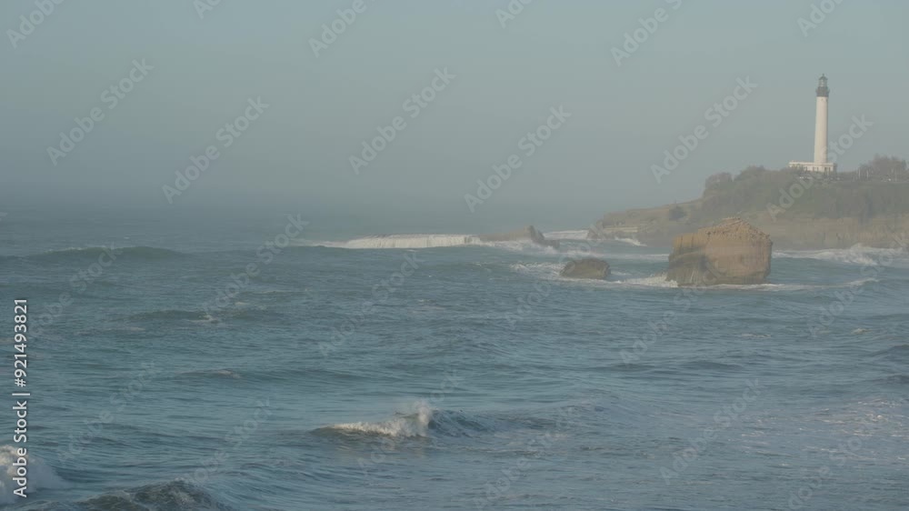 Lighthouse Overlooking the Atlantic Ocean at Dusk: 4K Coastal View. Biarritz, France. Lighthouse Overlooking the Atlantic Ocean at Dusk: 4K Coastal View. Biarritz, France.