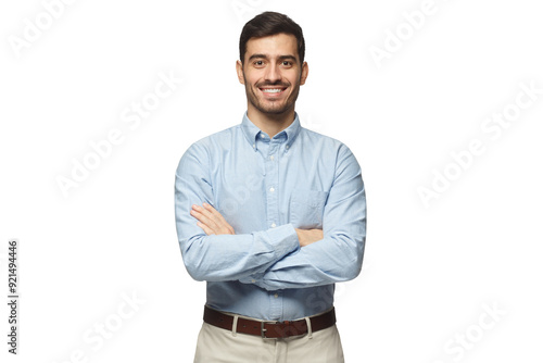 Modern businessman in casual blue shirt standing with crossed arms