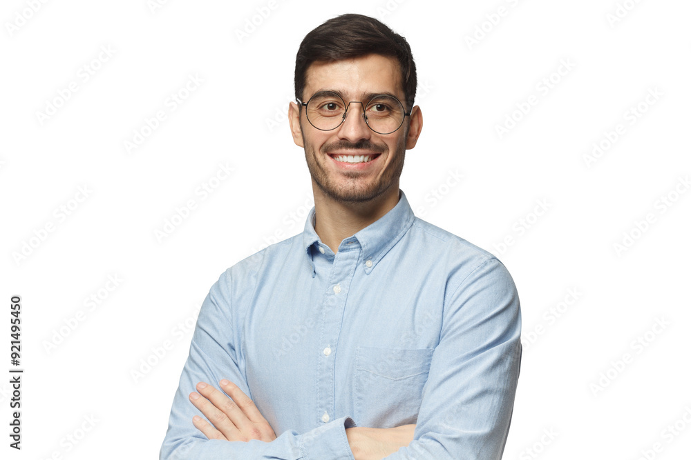 Handsome smiling businessman in blue shirt standing with crossed arms Handsome smiling businessman in blue shirt standing with crossed arms