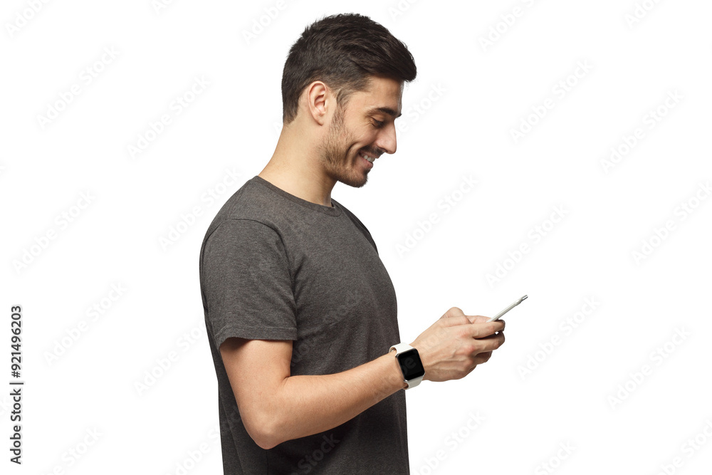 Side portrait of handsome man, wearing smartwatch, looking at phone screen Side portrait of handsome man, wearing smartwatch, looking at phone screen