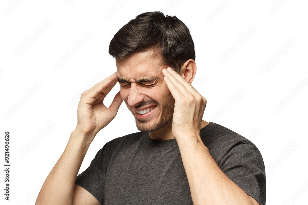 Close-up of young man in casual gray t-shirt, touching temples with fingers as if suffering from severe migraine Close-up of young man in casual gray t-shirt, touching temples with fingers as if suffering from severe migraine