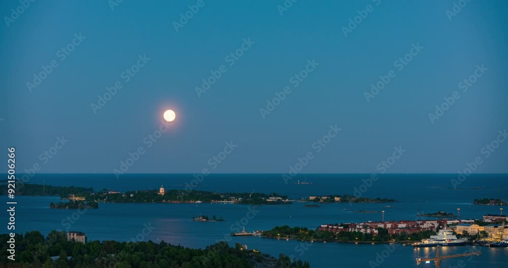 Timelapse of moon rising over Suomenlinna and Katajanokka, blue hour in Helsinki Timelapse of moon rising over Suomenlinna and Katajanokka, blue hour in Helsinki