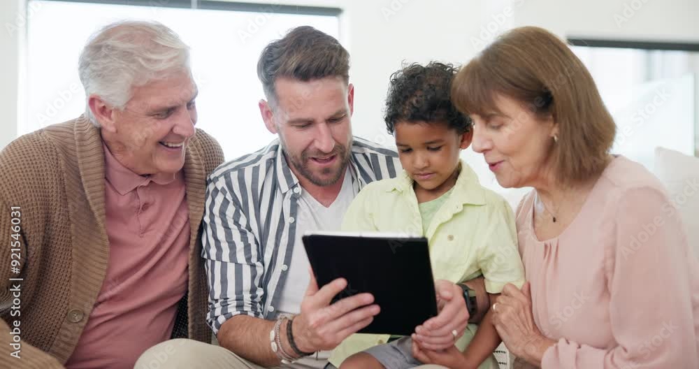 Father, grandparents and kid on tablet for home education, e learning support or watch video together on sofa. Interracial family, child and senior people on digital technology for school or games Father, grandparents and kid on tablet for home education, e learning support or watch video together on sofa. Interracial family, child and senior people on digital technology for school or games