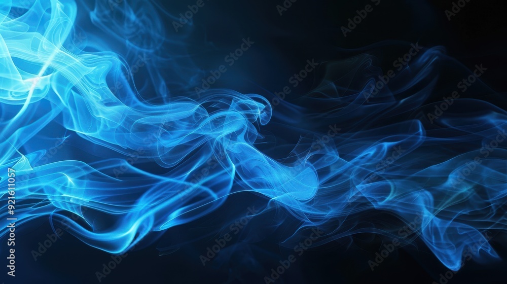 smoke that blows with a touch of blue light on a black background smoke that blows with a touch of blue light on a black background