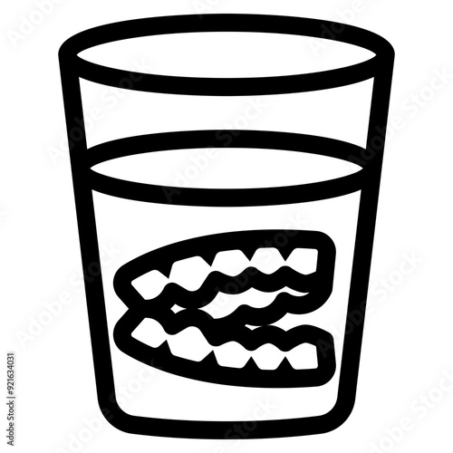 fake teeth dentures in a glass icon