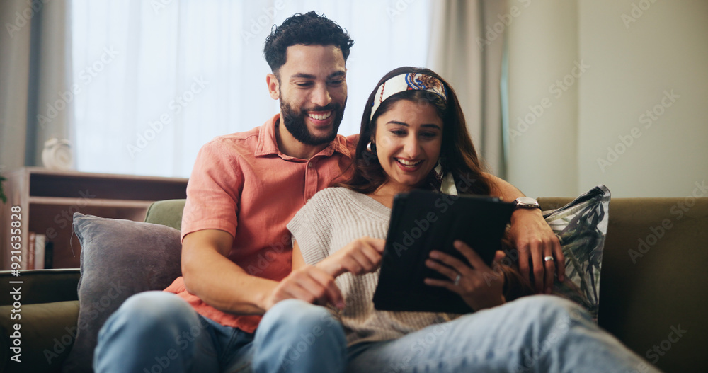 Couple, hug and tablet together on couch, home and watching video or online streaming for movies or bonding. Internet, networking and social media in living room with man and woman, care or affection Couple, hug and tablet together on couch, home and watching video or online streaming for movies or bonding. Internet, networking and social media in living room with man and woman, care or affection