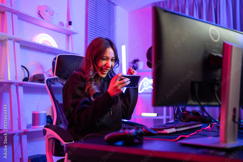 Asian young beautiful woman playing mobile game on smartphone at home. Asian young beautiful woman playing mobile game on smartphone at home.