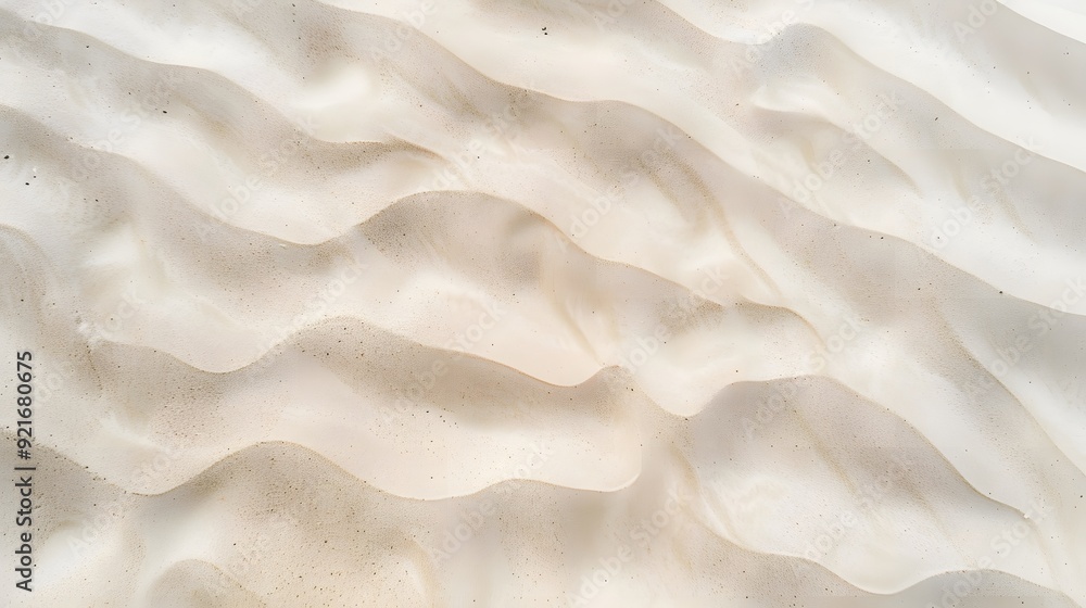 Aerial perspective of smooth, clean beach sand with subtle natural patterns