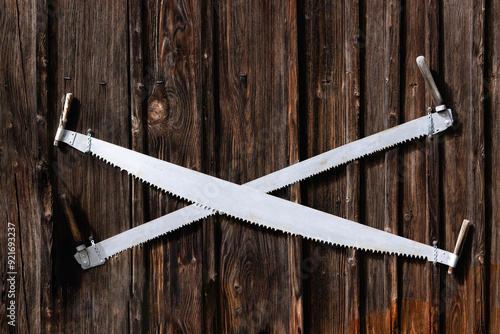 Canvas Print The crosscut saw or two man saw is mounted on a wooden wall.