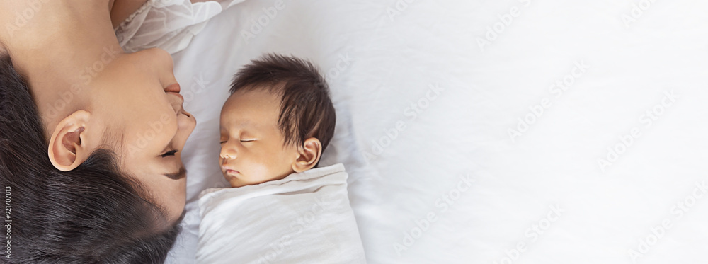 Closeup portrait of beautiful young asian mother day kissing her newborn baby. Healthcare and medical Indian hispanic family love lifestyle asia mother’s day parenthood concept panoramic banner Closeup portrait of beautiful young asian mother day kissing her newborn baby. Healthcare and medical Indian hispanic family love lifestyle asia mother’s day parenthood concept panoramic banner