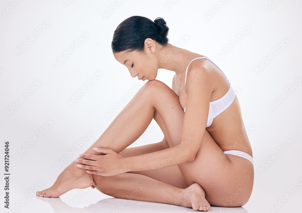 Woman, hair removal and clean legs in studio for skincare, beauty and soft touch on white background. Female person, epilation and grooming results for maintenance, dermatology and cosmetics glow Woman, hair removal and clean legs in studio for skincare, beauty and soft touch on white background. Female person, epilation and grooming results for maintenance, dermatology and cosmetics glow
