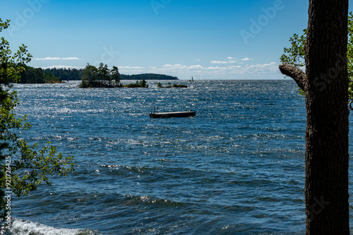 Looking out over lake Vattern Motala Sweden with floating jetty for bathing photo