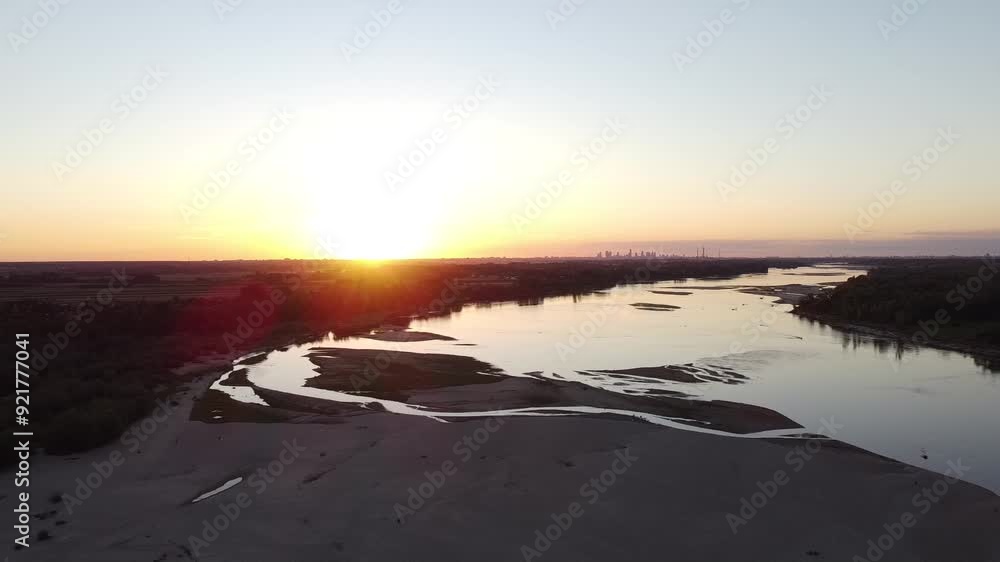 Aerial view of Vistula river at sunset, with city of Warsaw on the horizon. Aerial view of Vistula river at sunset, with city of Warsaw on the horizon.