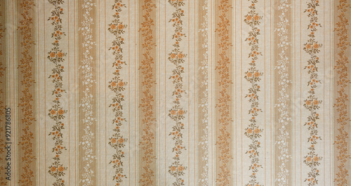 Old wallpaper on the wall. Old wallpaper for texture or background. photo