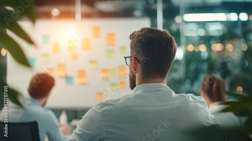 Diverse Team Brainstorming in Office Setting with Whiteboard Planning Session