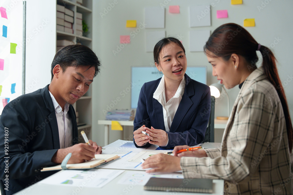 Asian Business people meeting time working with new startup project. Idea presentation, analyze plans. Business Discussing some business ideas. Teamwork concept. Asian Business people meeting time working with new startup project. Idea presentation, analyze plans. Business Discussing some business ideas. Teamwork concept.