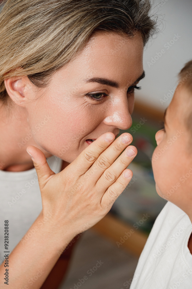 Happy Mother and her Little Son Sharing Secrets at Home Happy Mother and her Little Son Sharing Secrets at Home