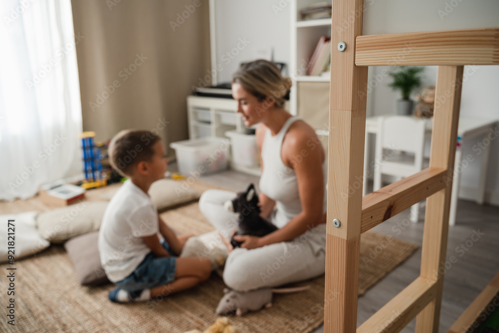 Fototapeta premium Mother and Little Son Playing Together with Stuffed Toys on the Floor at Home