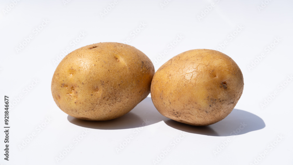 Minimalist Composition of Two Potatoes on White Minimalist Composition of Two Potatoes on White