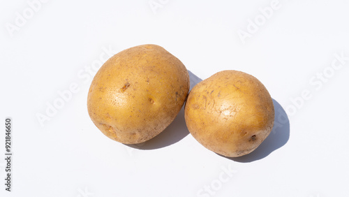 Simple Display of Two Potatoes on a White Background