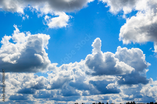 Cloud of unusual shape in the form of a phallus or fuck you on the background of blue sky. Funny sign in the sky without photomontage