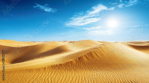 A breathtaking view of the Sahara vast, rolling sand dunes under a clear blue sky. The golden sands and dramatic landscape capture the arid and majestic desert environment photo