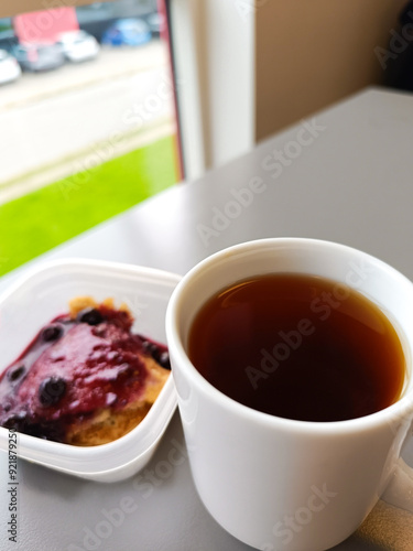 Coffee cup with slice of cake berry. Pie and Coffee