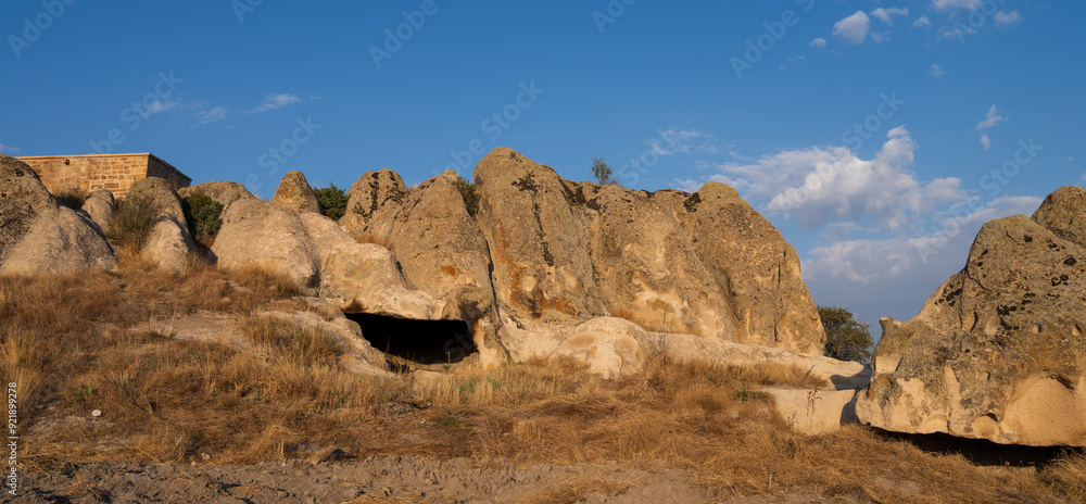 Fototapeta premium Historical Forty Stairs Rock and Phrygian rock chambers by Lake Emre. Phrygian valley. Travel destinations in Turkey. Ihsaniye district, Afyonkarahisar city