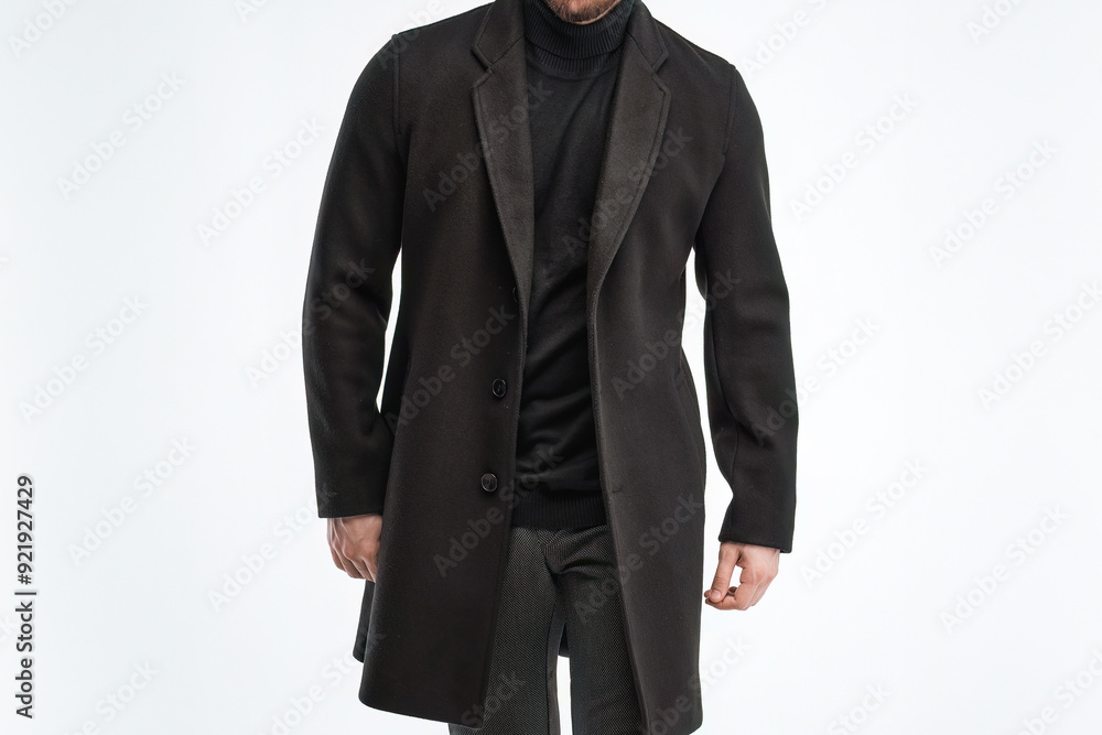 Man wearing black overcoat on white background Man wearing black overcoat on white background
